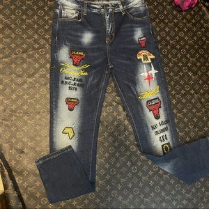 Fashion jeans embroidered bulls L. V embroidered JEANS width 14 inseam 27”